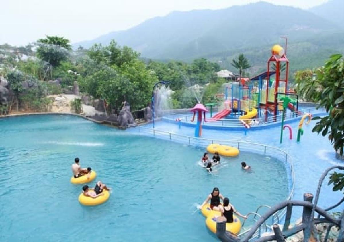 A water park with people in tubes

Description automatically generated