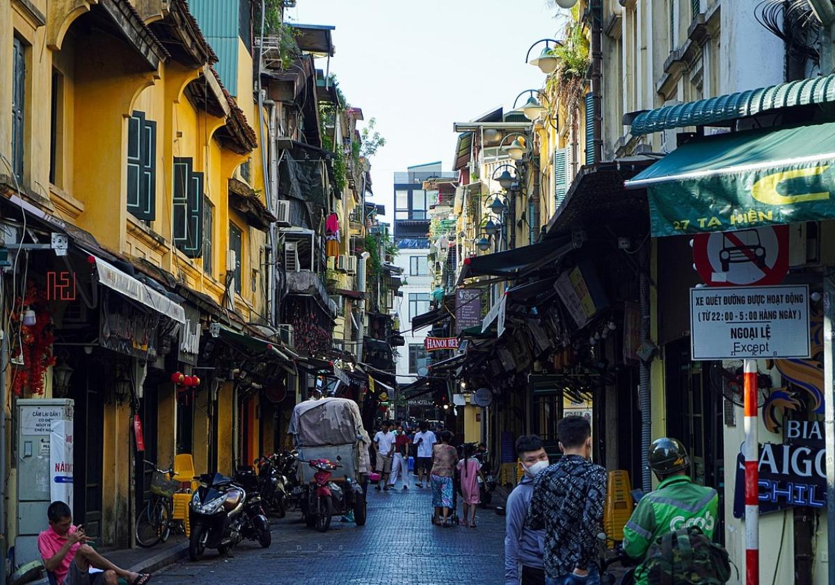 A street with people walking on it

Description automatically generated