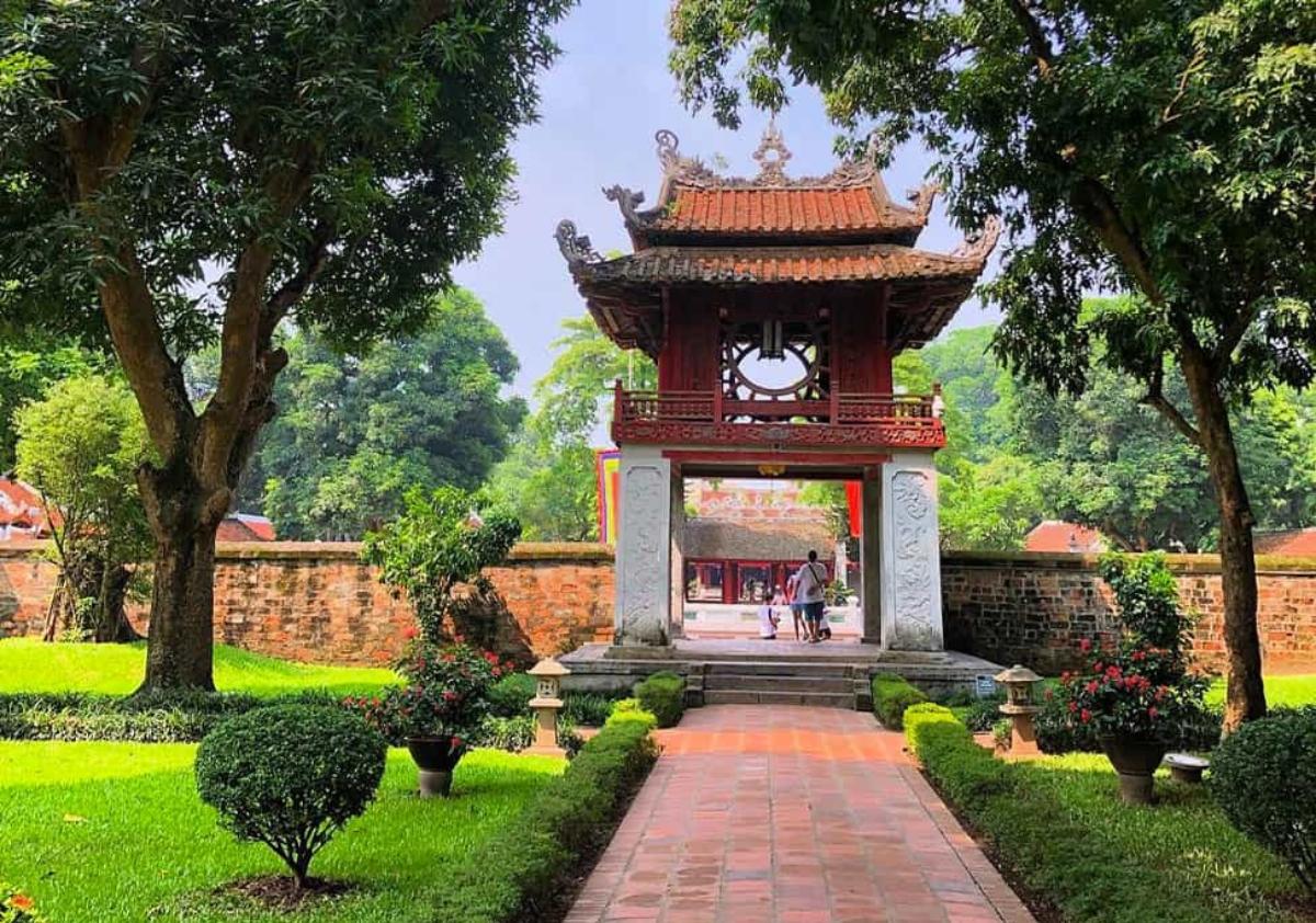 A pagoda with a brick walkway and trees

Description automatically generated with medium confidence